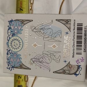 New in box Melania Clara Fortune wheel necklace in gold color way